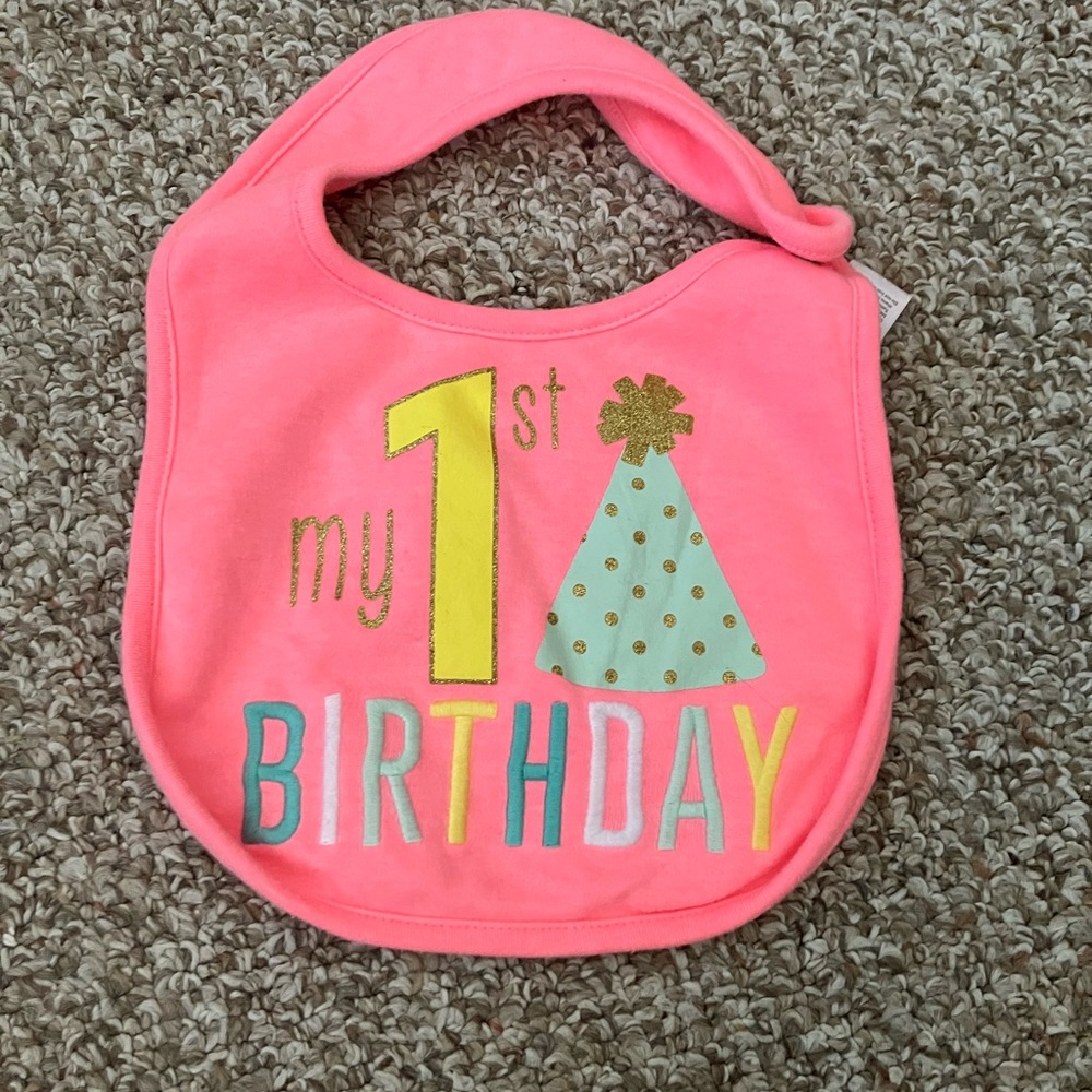 Four baby girl bibs, including 1st birthday!